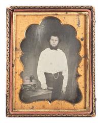 [EARLY PHOTOGRAPHY]. Quarter plate daguerreotype featuring a young carpenter posed with a wood plane and many chisels.