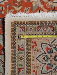An Indo-Tabriz Wool Rug