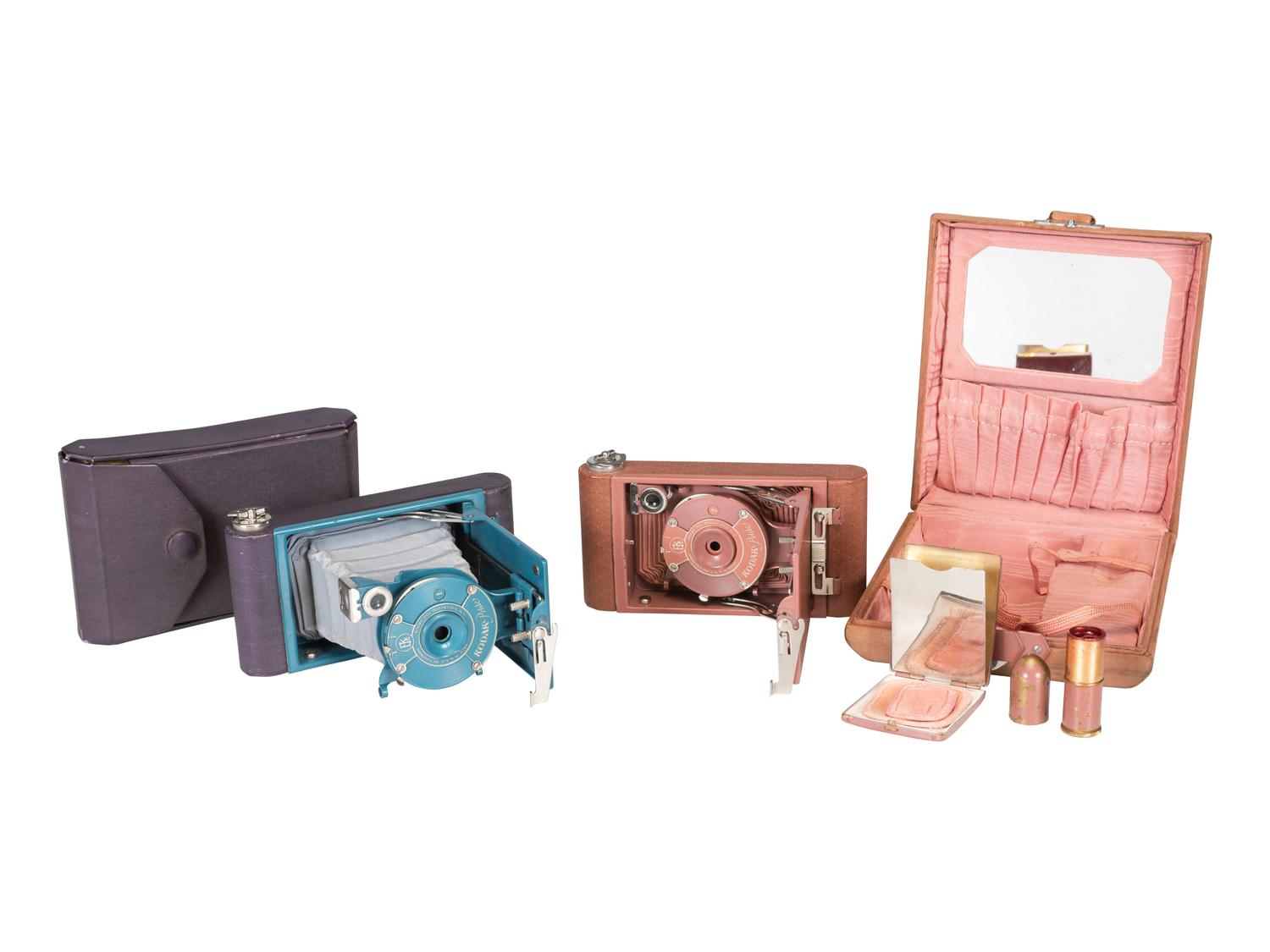 [EARLY PHOTOGRAPHY]. Two Kodak Petite Cameras, one with original vanity case.