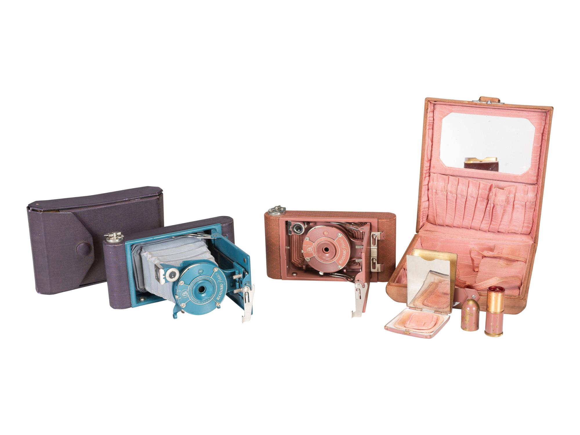 [EARLY PHOTOGRAPHY]. Two Kodak Petite Cameras, one with original vanity case.