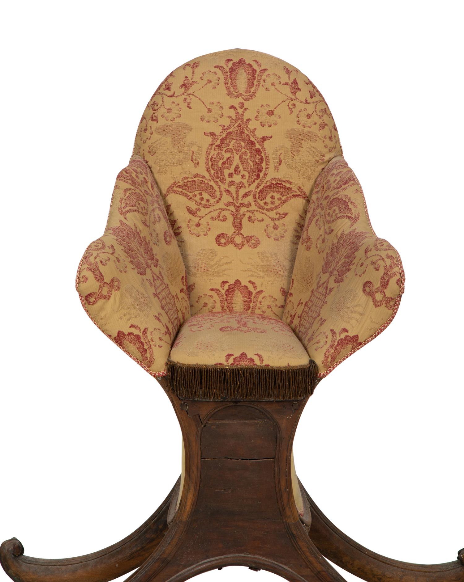 A Venetian Carved Walnut Gondola Chair