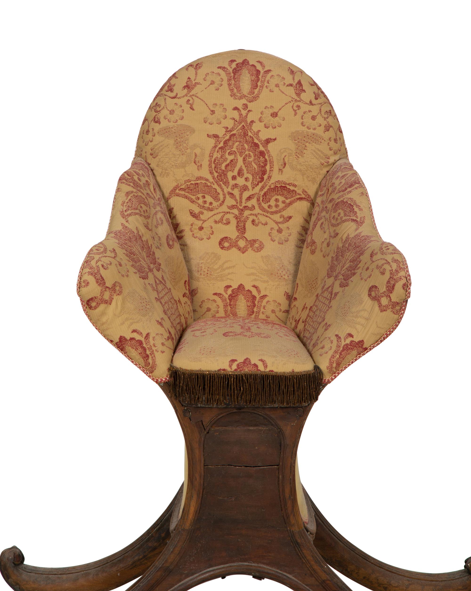 A Venetian Carved Walnut Gondola Chair