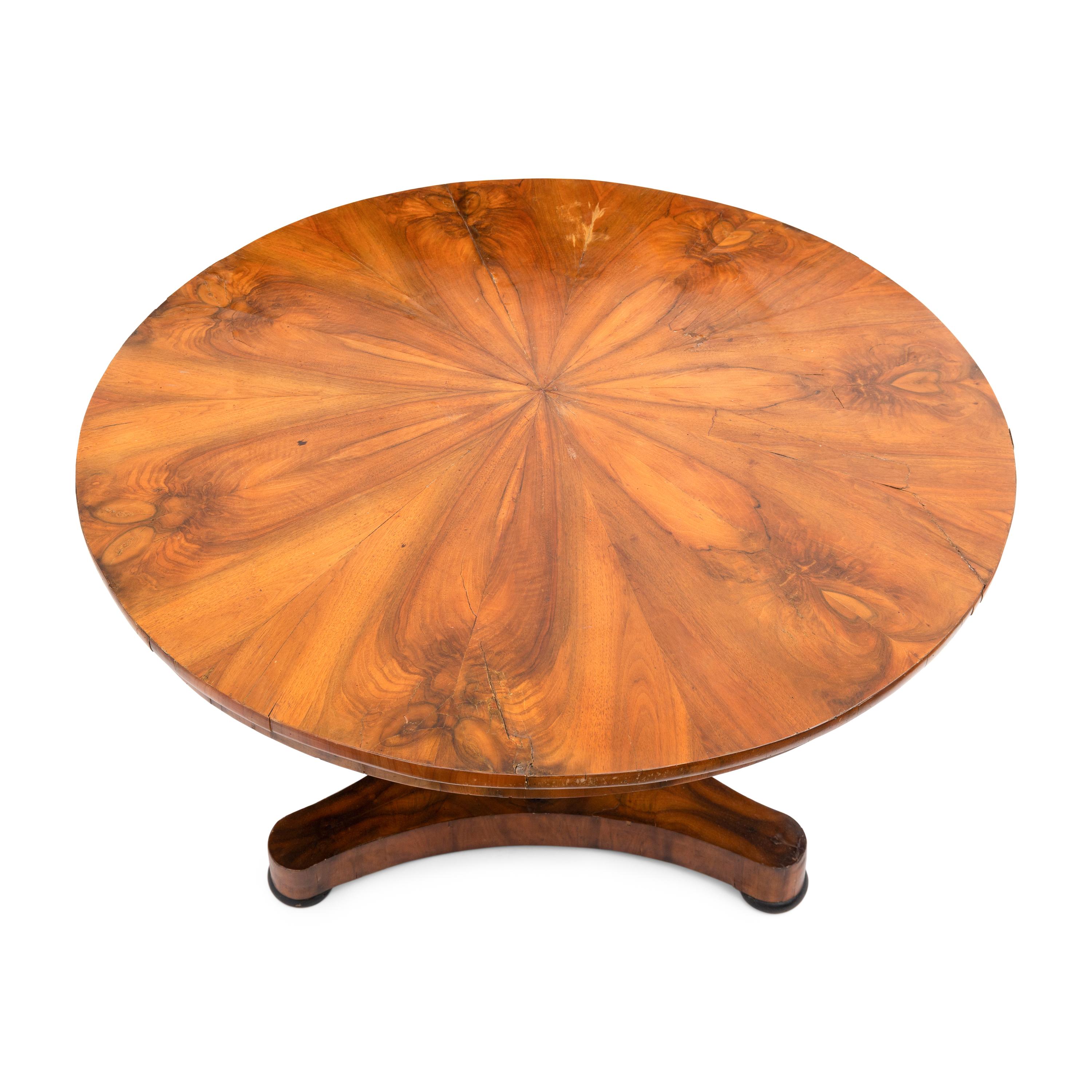 A Biedermeier Figured Walnut and Ebonized Center Table