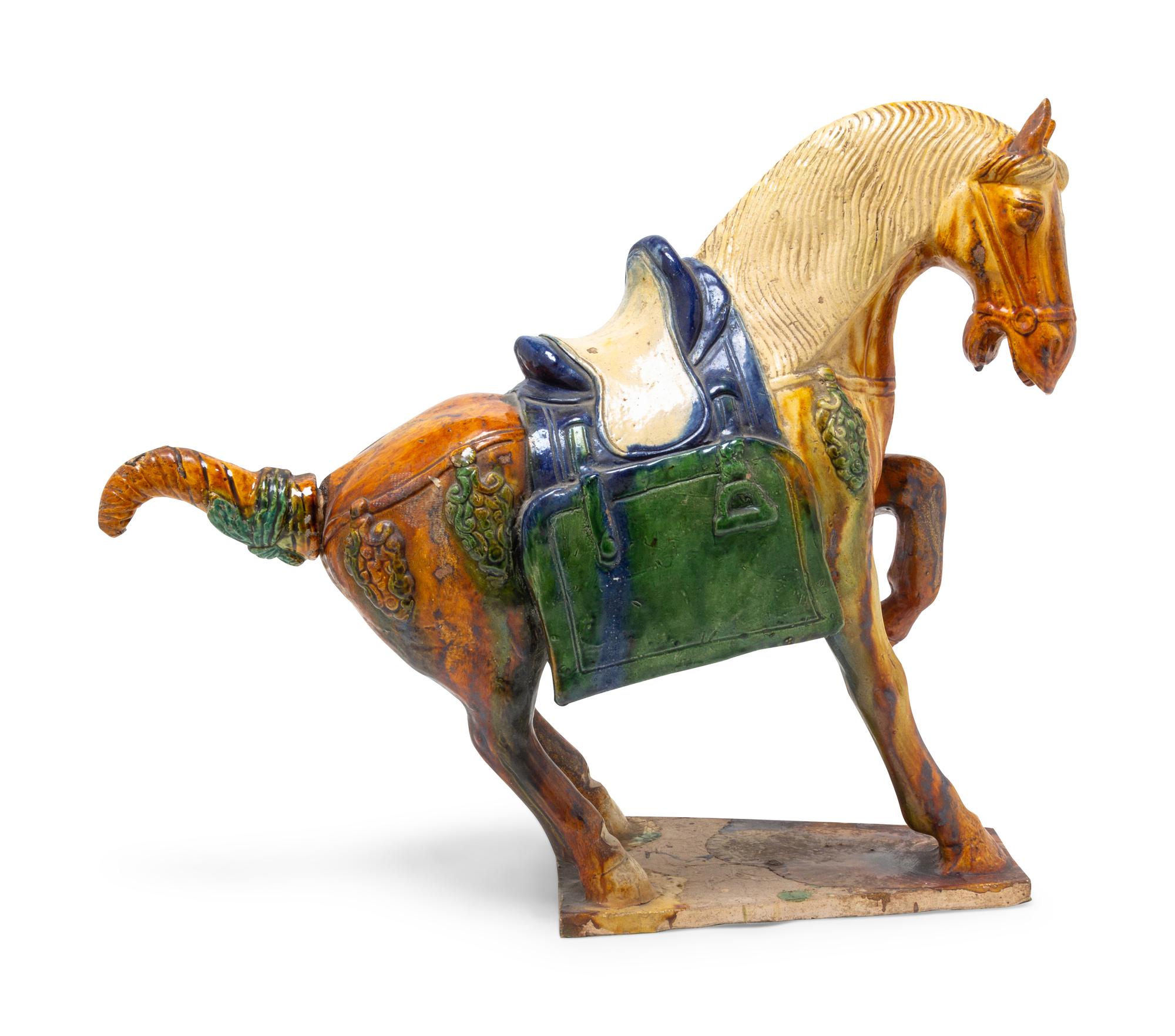 A Chinese Sancai Glazed Pottery Figure of a Horse