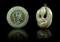 A Carved Jade Pendant Diameter of first 2 inches.