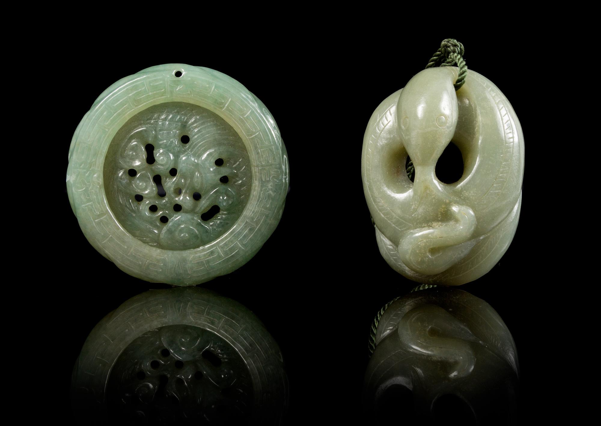 A Carved Jade Pendant Diameter of first 2 inches.