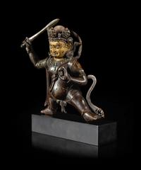 A Sino-Tibetan Parcel-Gilt Bronze Figure of Jambhala