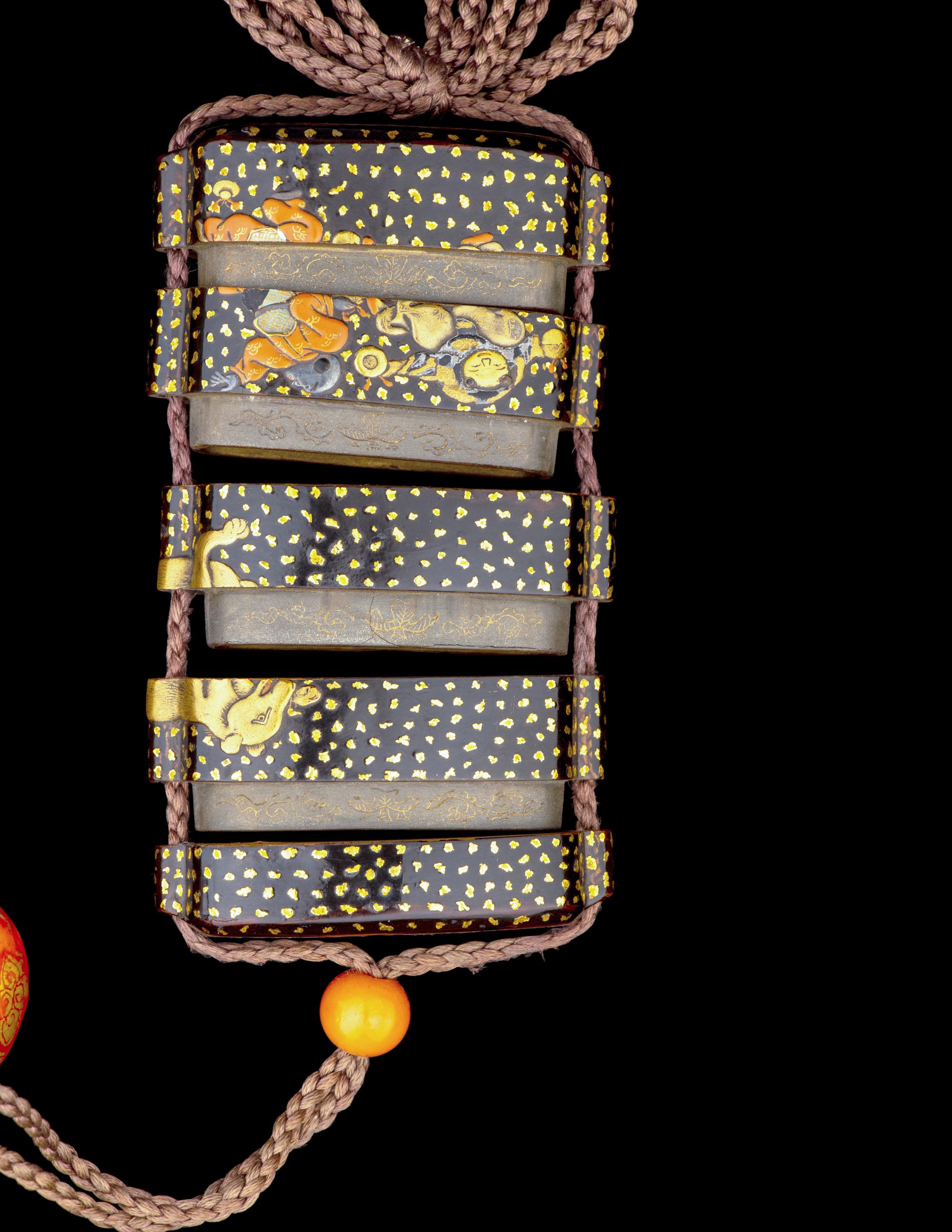 A Japanese Gold and Black Lacquer Four-Case Inro