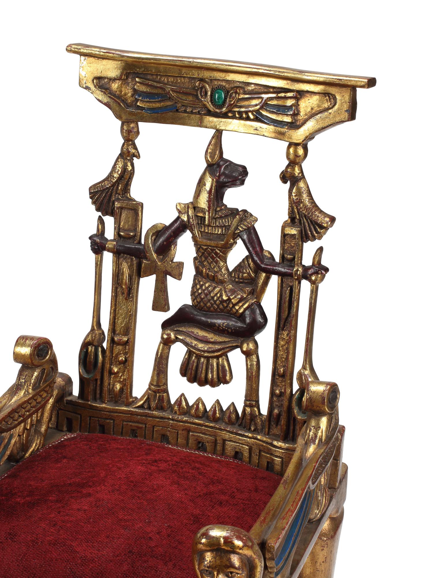 A Pair of Egyptian Style Painted and Parcel-Gilt Armchairs