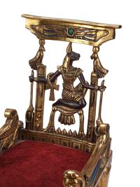 A Pair of Egyptian Style Painted and Parcel-Gilt Armchairs