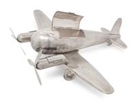 A Large Silvered Metal Airplane-Form Table Top Smoking Set