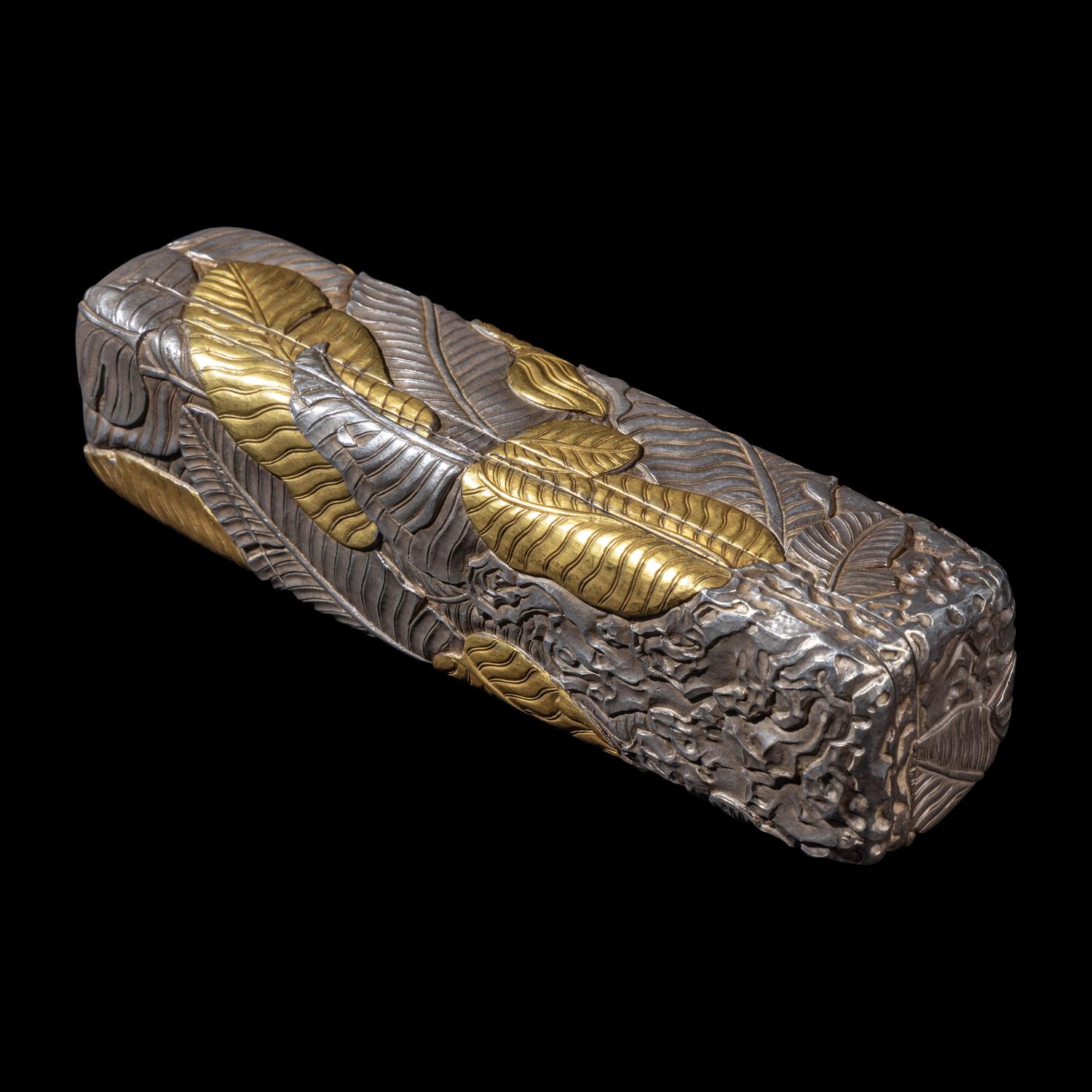 A Chinese Parcel-Gilt Silver Repoussé 'Plantain Leaves' Rectangular Scroll Box, Incised Qianlong Mark 清乾隆乙卯（1796）銀鎏金鏨蕉葉紋手卷機關盒