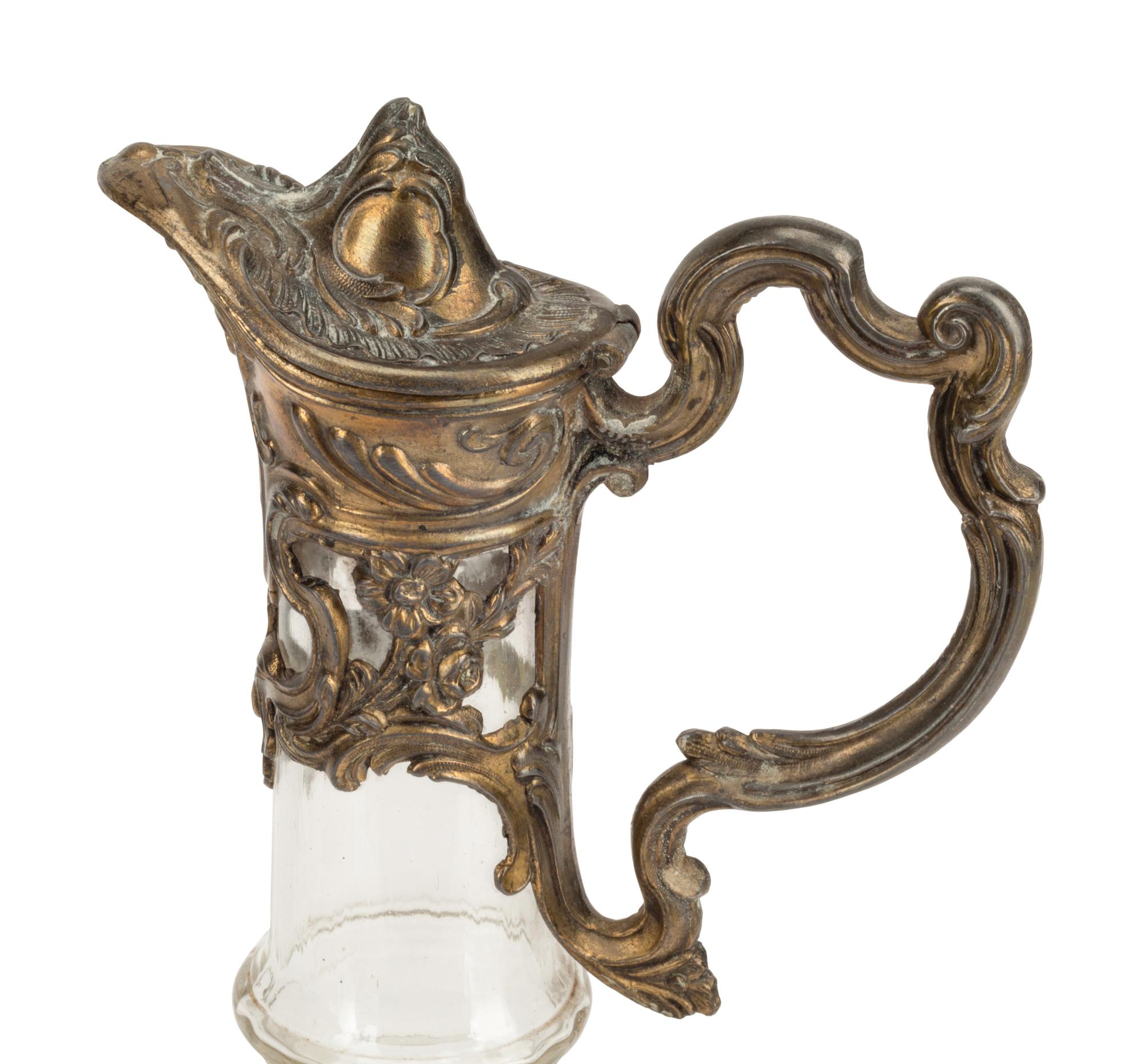 Two Continental Pewter Mounted Glass Claret Jugs