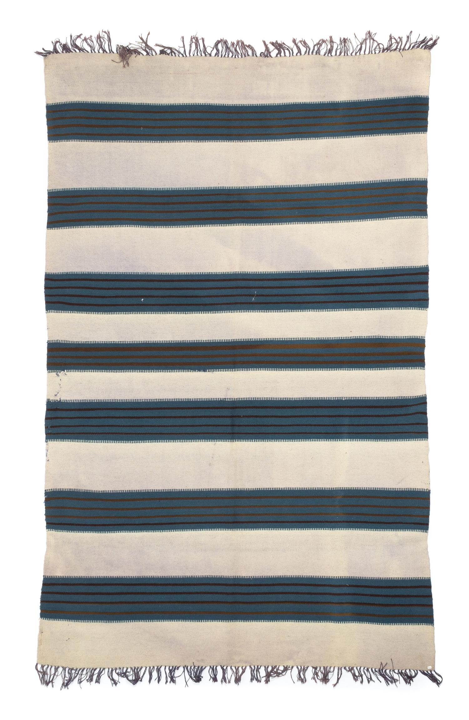 A Chimayo Blanket 76 x 49 1/2 inches.