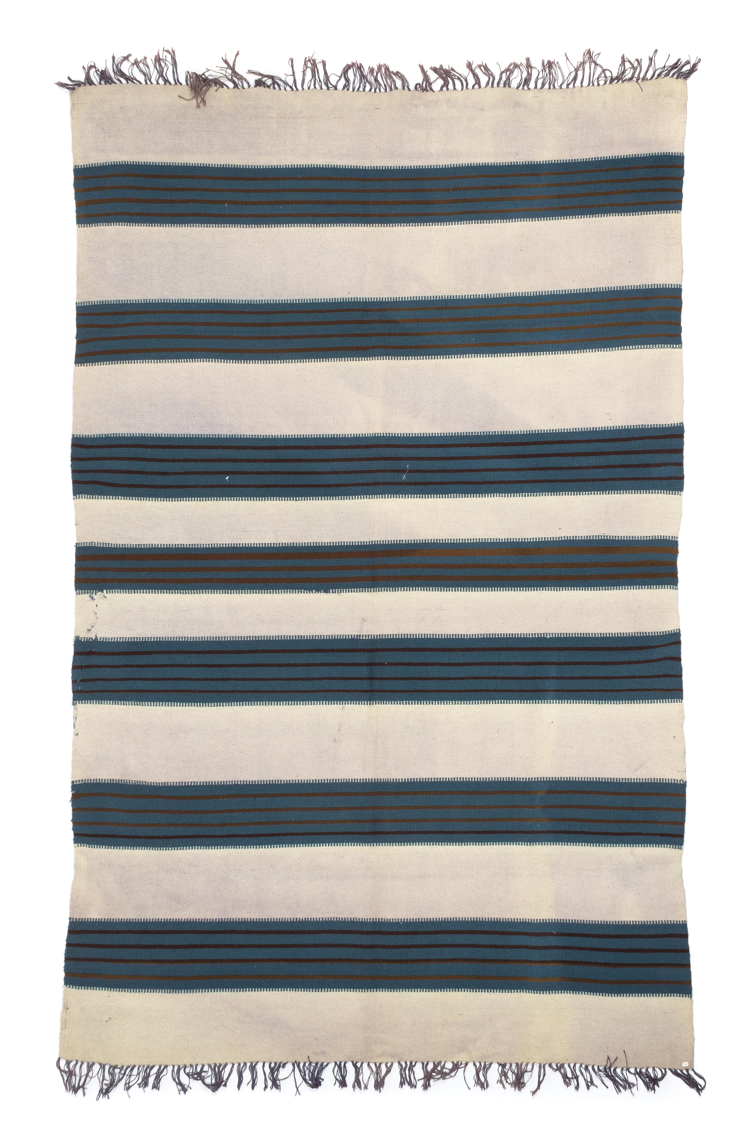 A Chimayo Blanket 76 x 49 1/2 inches.