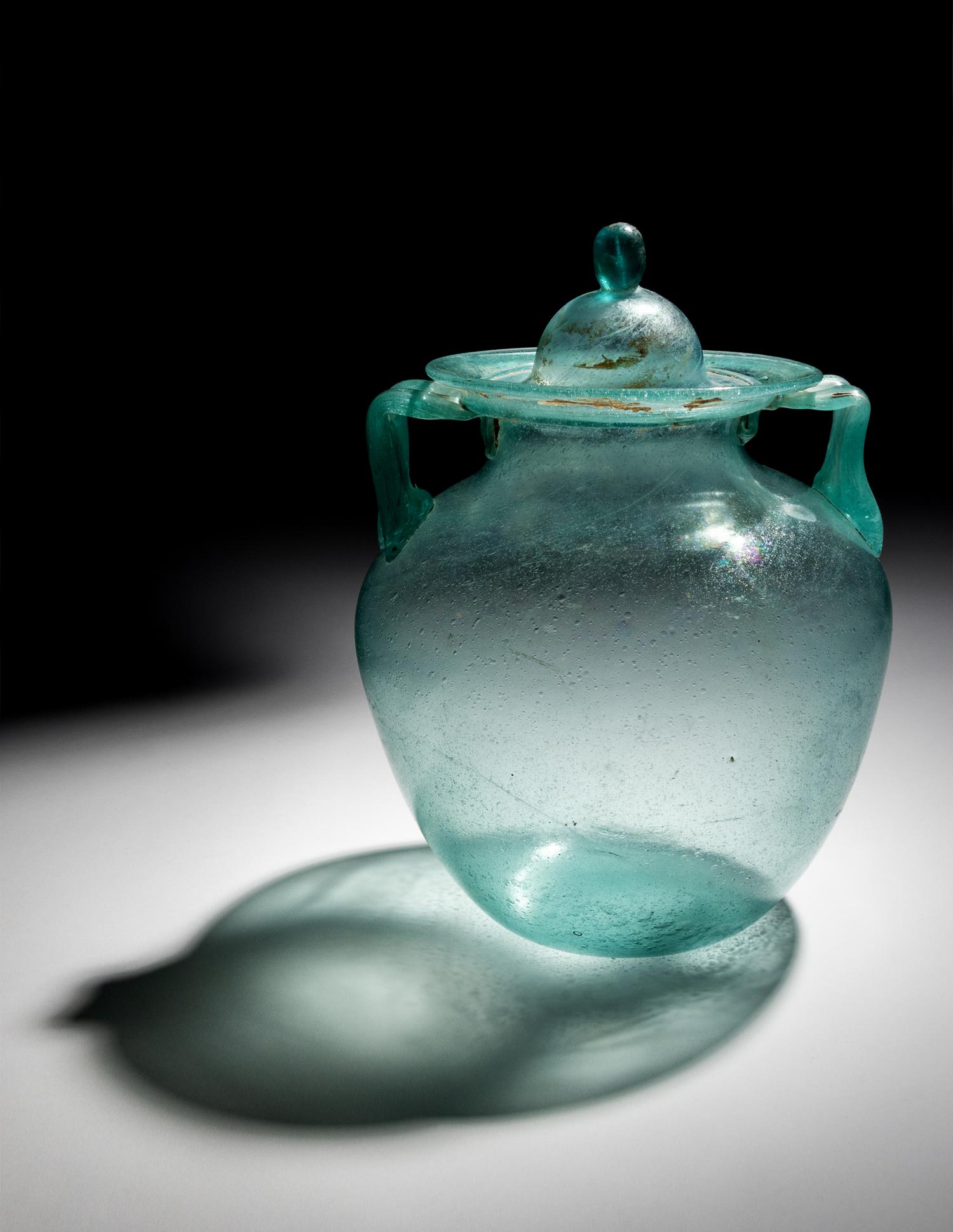 A Roman Glass Cinerary Urn and Lid