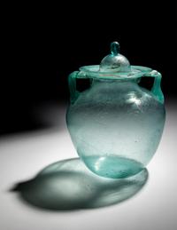 A Roman Glass Cinerary Urn and Lid