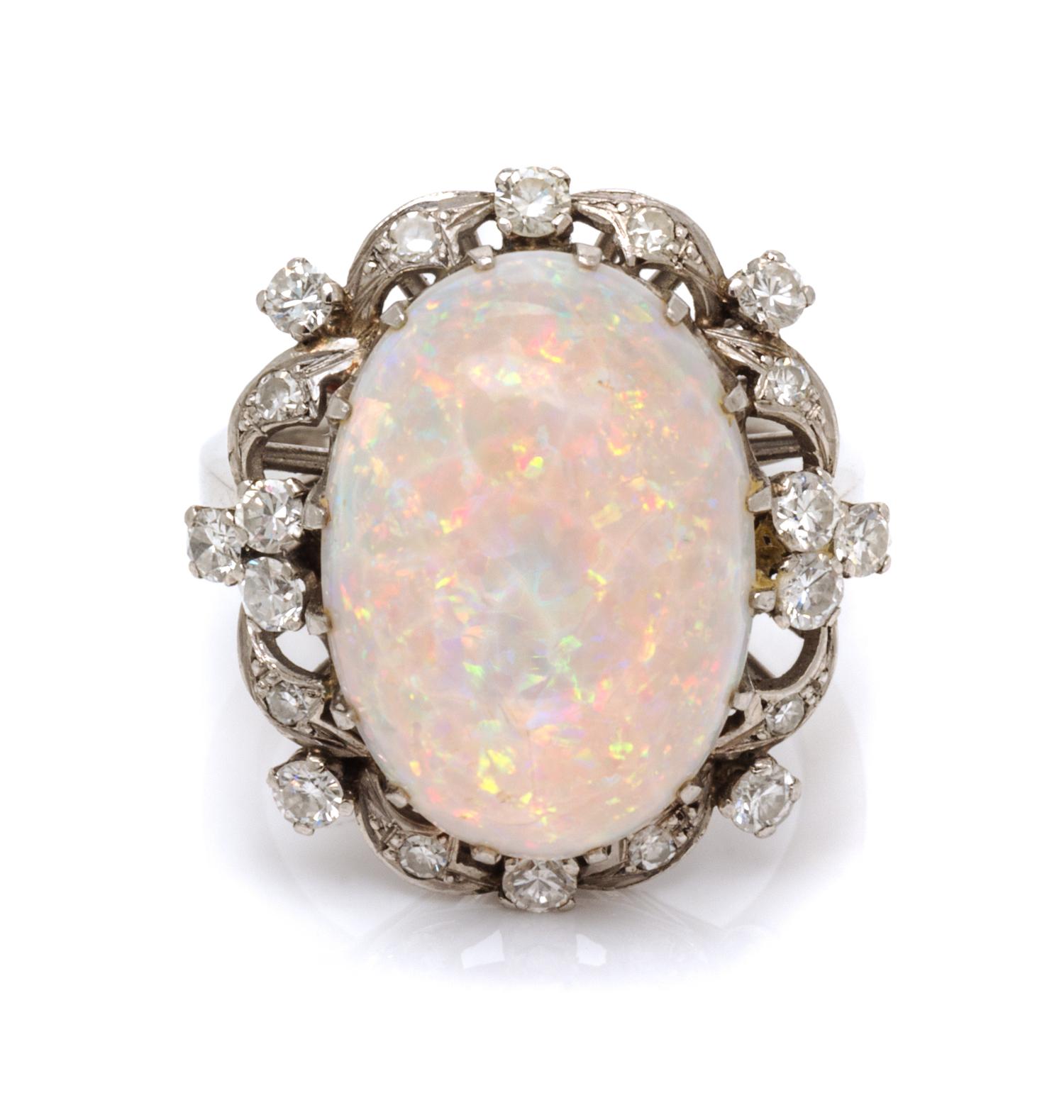 A Platinum, Opal and Diamond Ring, 7.40 dwts.