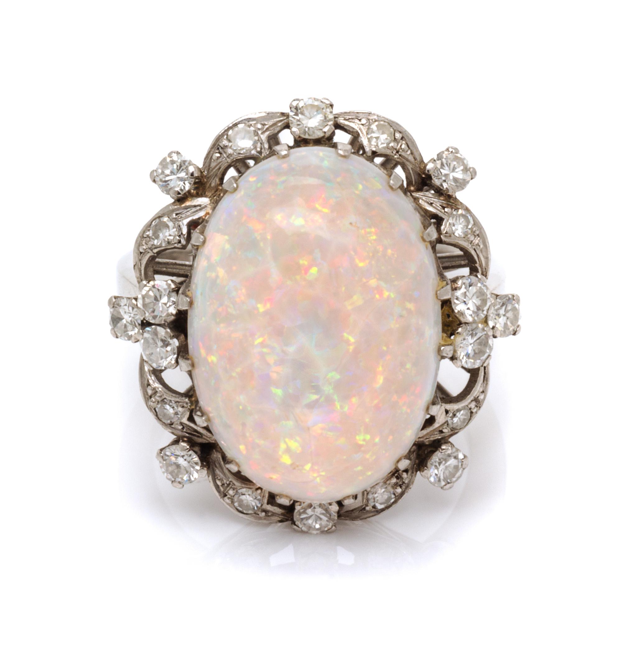 A Platinum, Opal and Diamond Ring, 7.40 dwts.