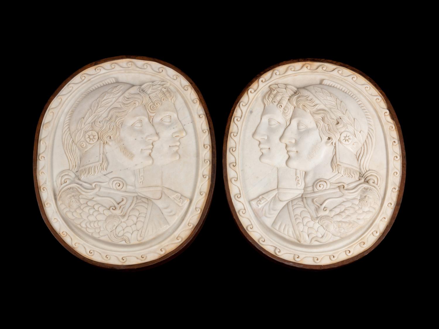 A Pair of Italian Neoclassical Style Iron-Mounted Marble Portrait Reliefs of a Caesar