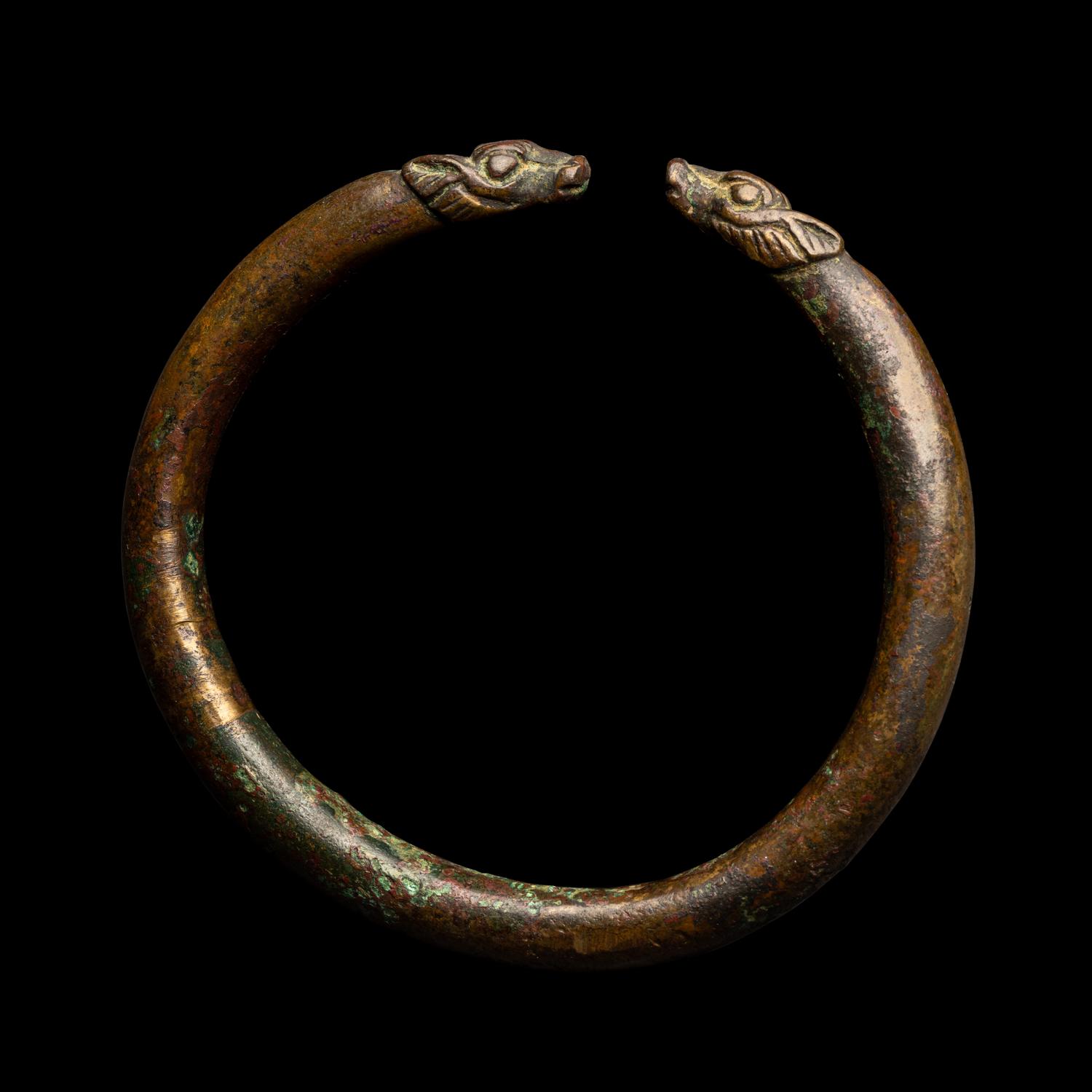 An Achaemenid or Lydian Bronze Bracelet with Calf-head Terminals
