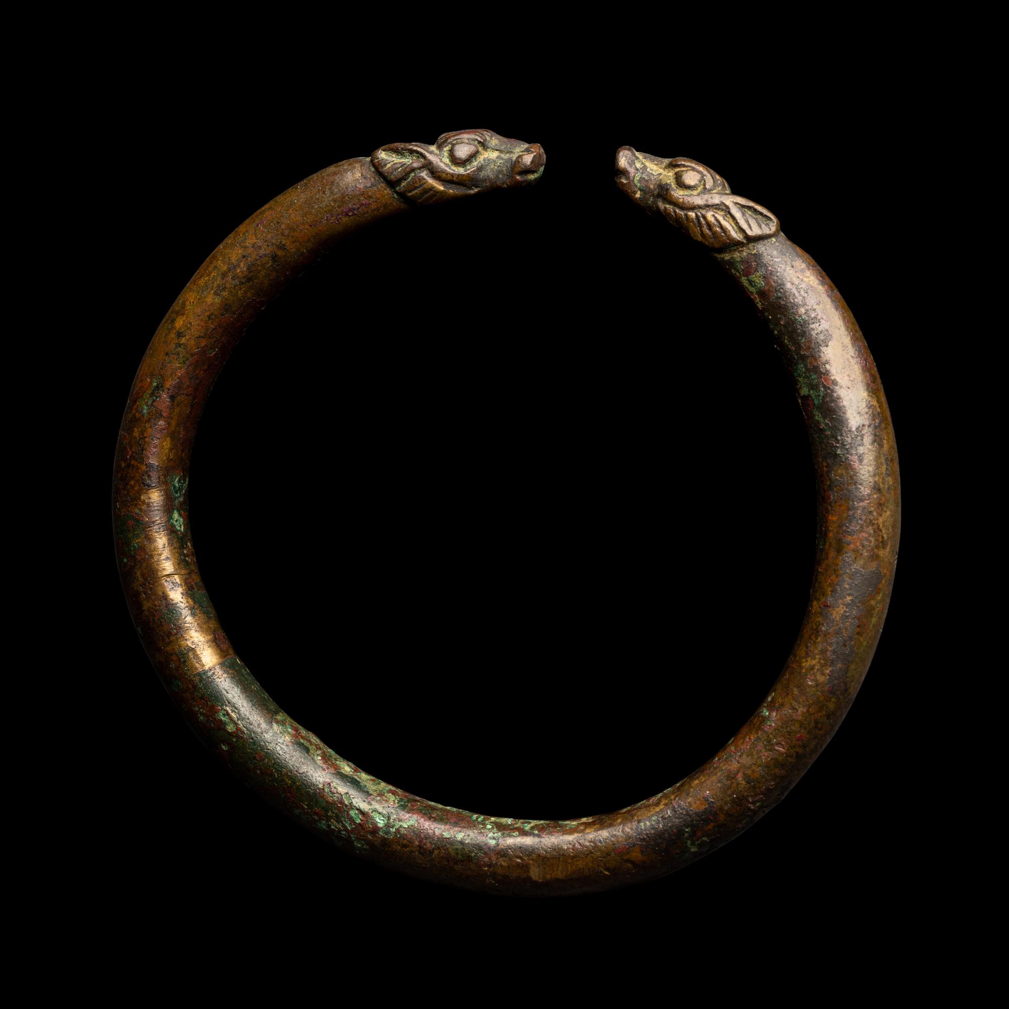 An Achaemenid or Lydian Bronze Bracelet with Calf-head Terminals