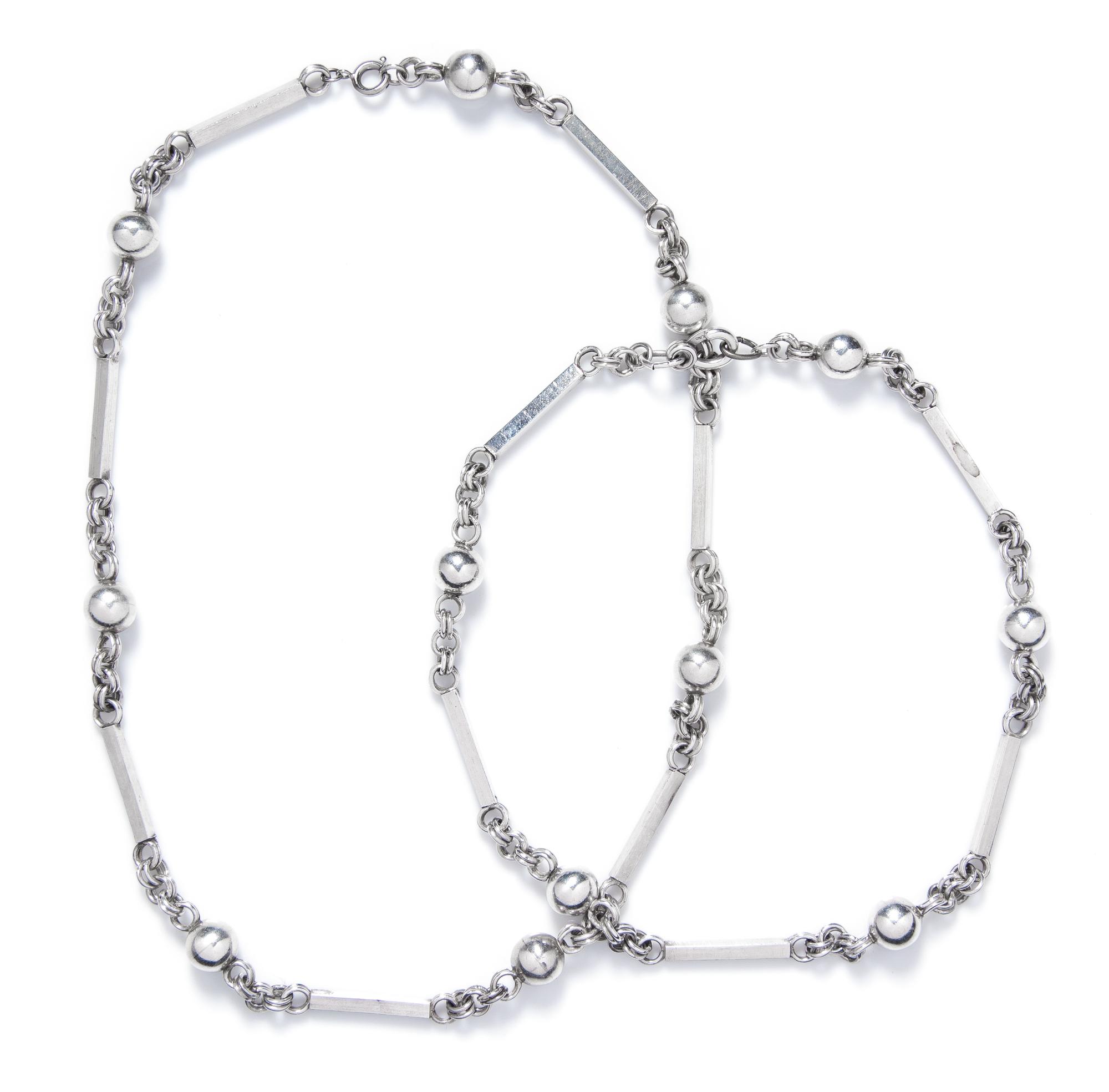 A Pair of Sterling Silver Necklaces, 84.90 dwts.