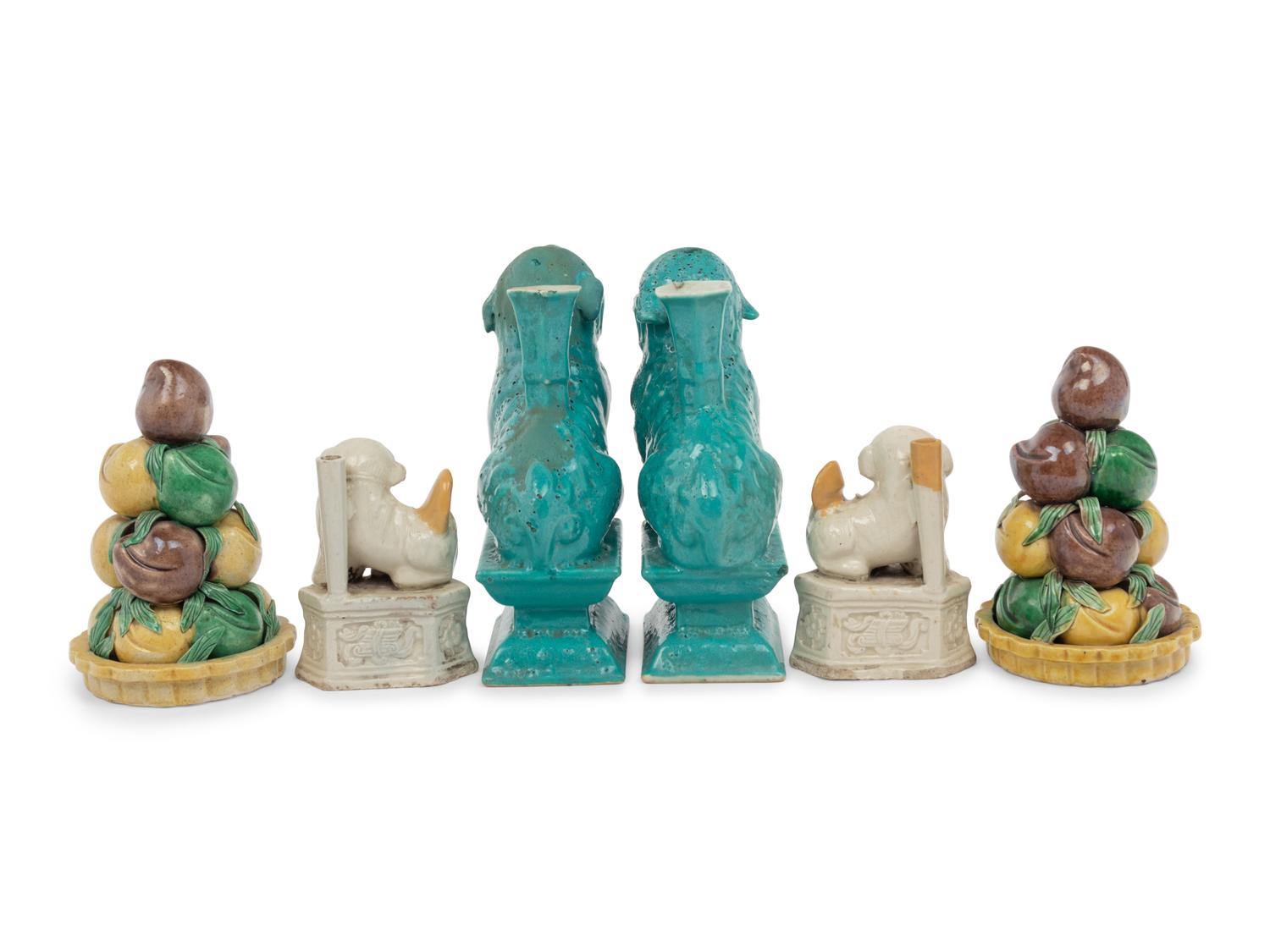 Two Pairs of Chinese Monochrome Glazed Porcelain Figures of Fu Lions and a Pair of Sancai Glazed Porcelain Models of Fruit