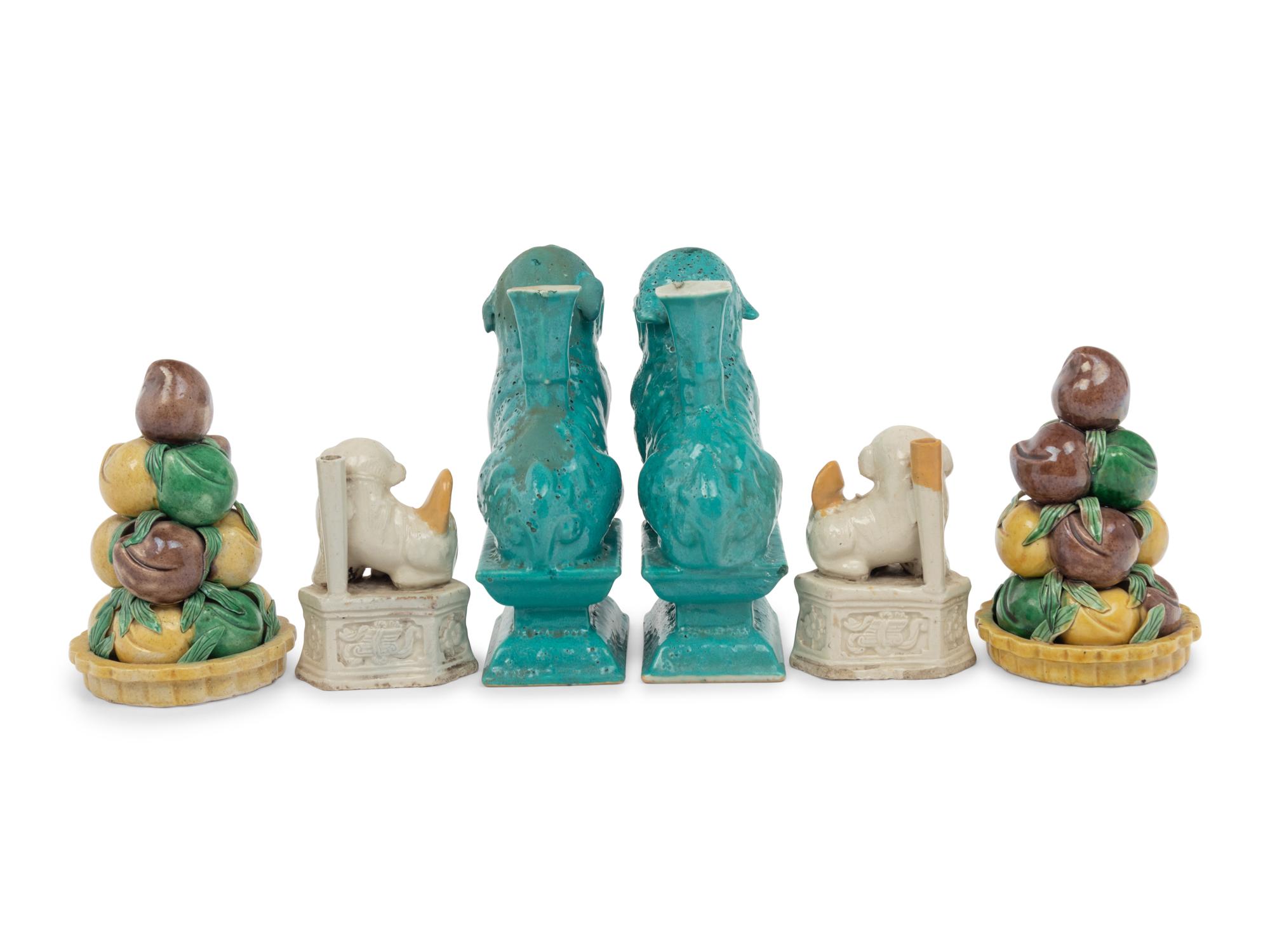 Two Pairs of Chinese Monochrome Glazed Porcelain Figures of Fu Lions and a Pair of Sancai Glazed Porcelain Models of Fruit