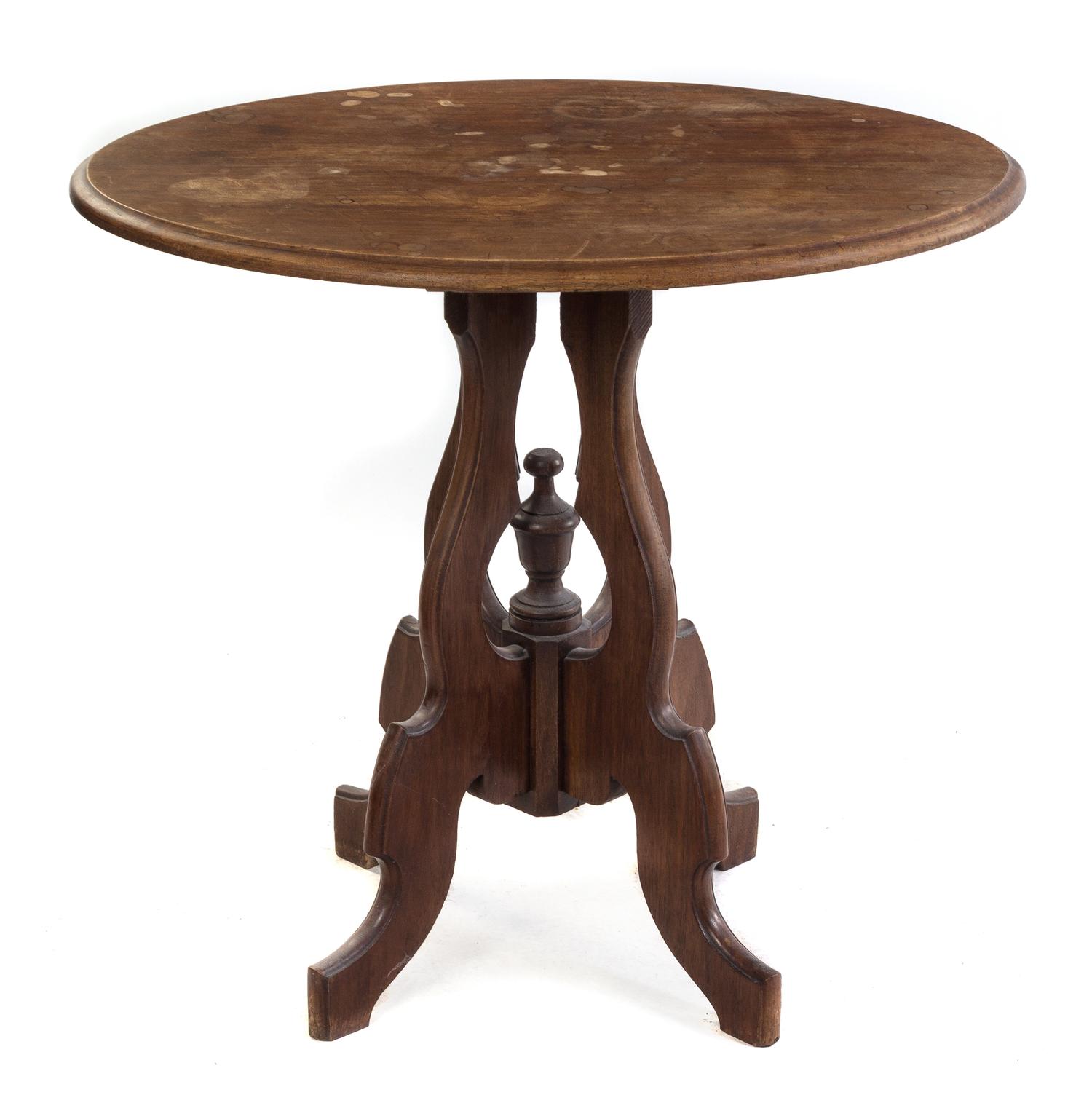 A Victorian Walnut Center Table Height 27 1/2 x width 31 x depth 24 inches. — LATE 19TH CENTURY