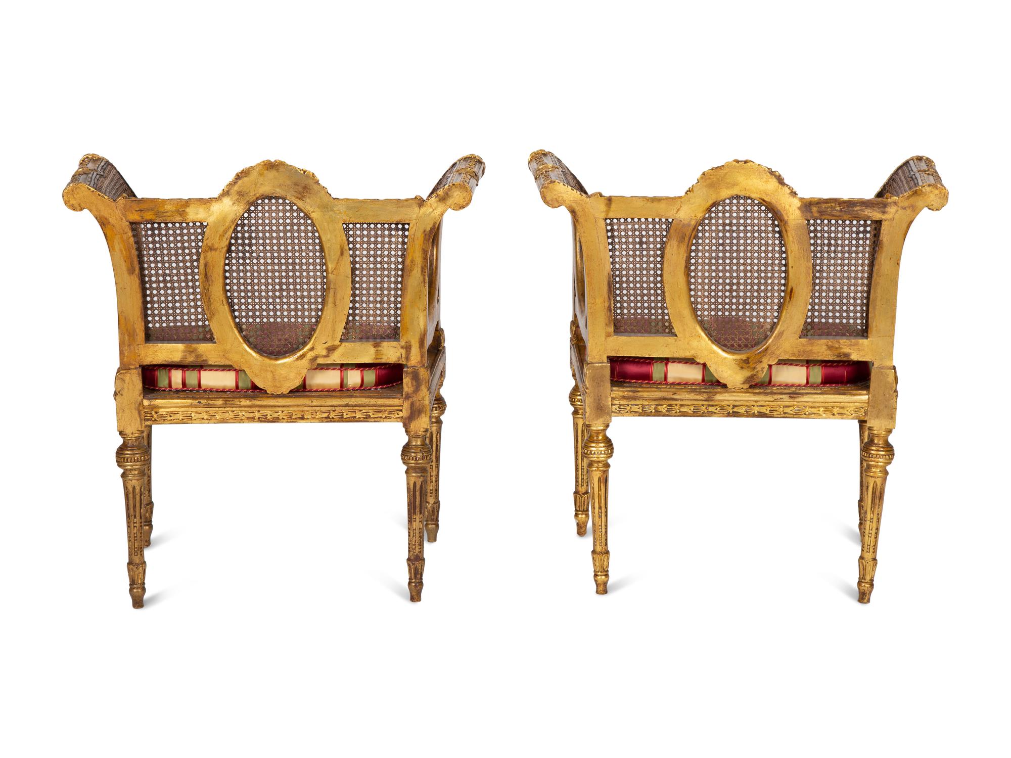 A Pair of Louis XVI Style Giltwood Cane-Back Benches