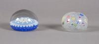 A Group of Two Baccarat Paperweights, Diameter of first 3 inches.