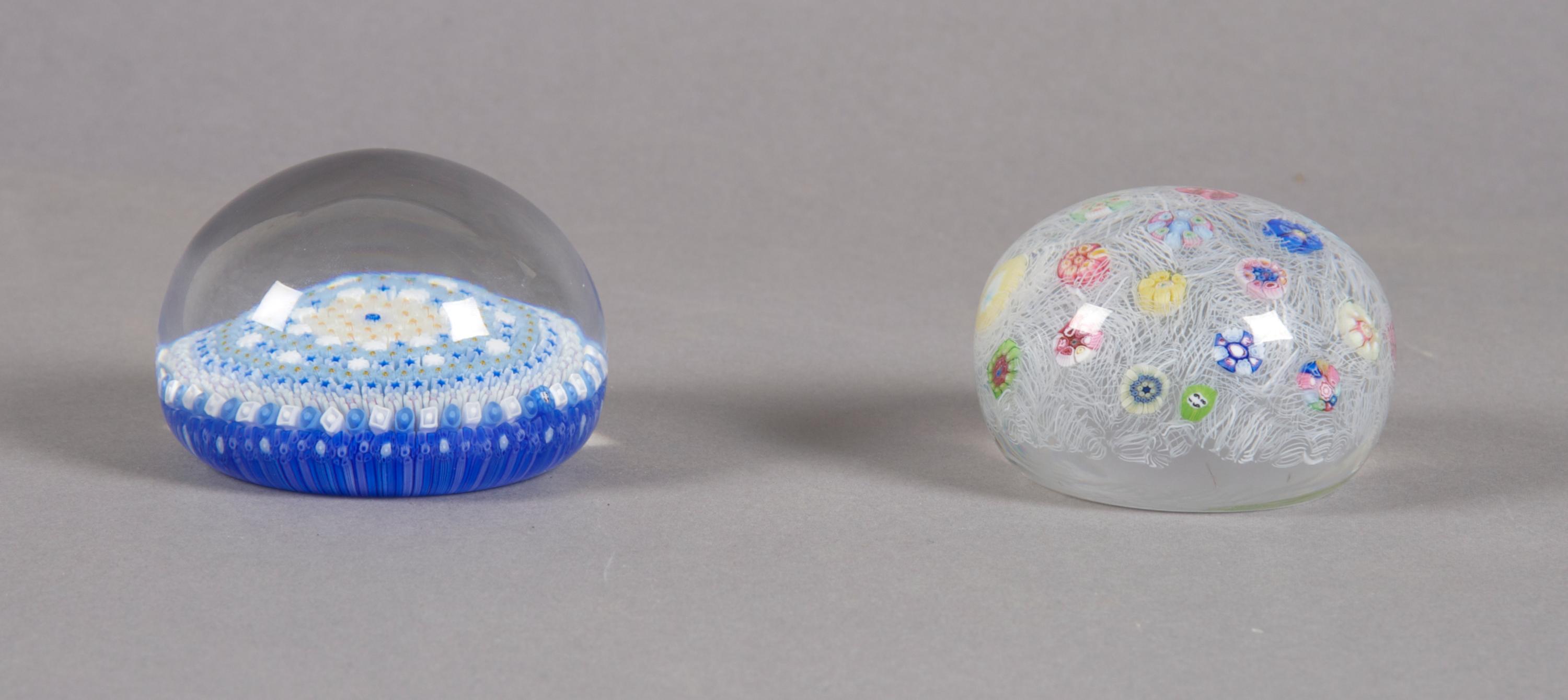 A Group of Two Baccarat Paperweights, Diameter of first 3 inches.