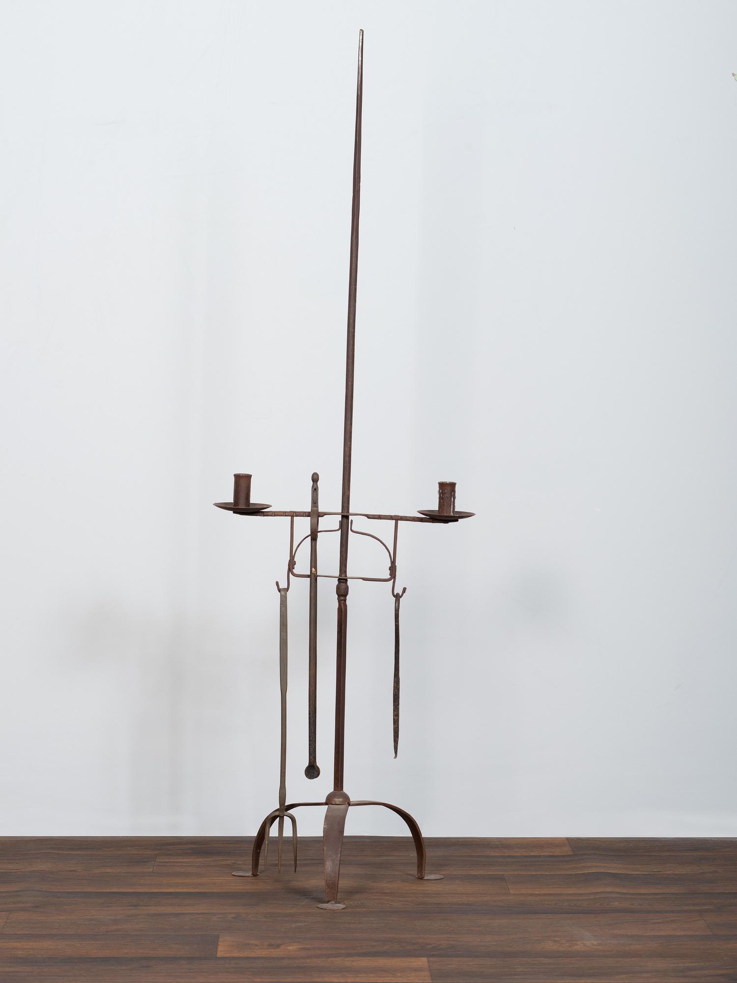 A Set of Wrought and Forged Iron Fireplace Tools on Stand