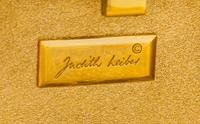 A Judith Leiber Black Floral Minaudiere, 3.75"H x 5"W x 1"D; Strap drop: 19.5".