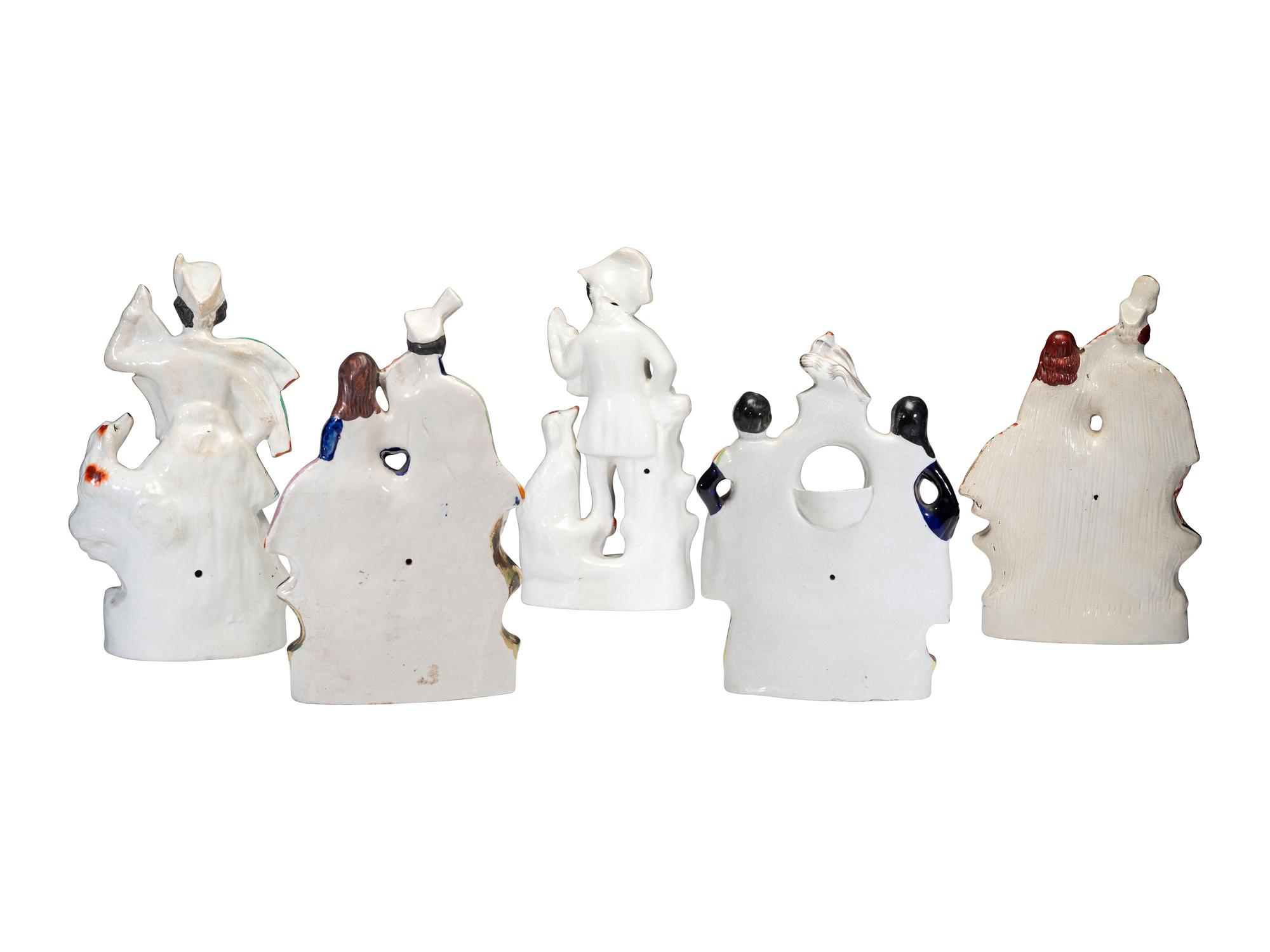 Four Staffordshire Glazed Figures and a Figural Watch Hutch