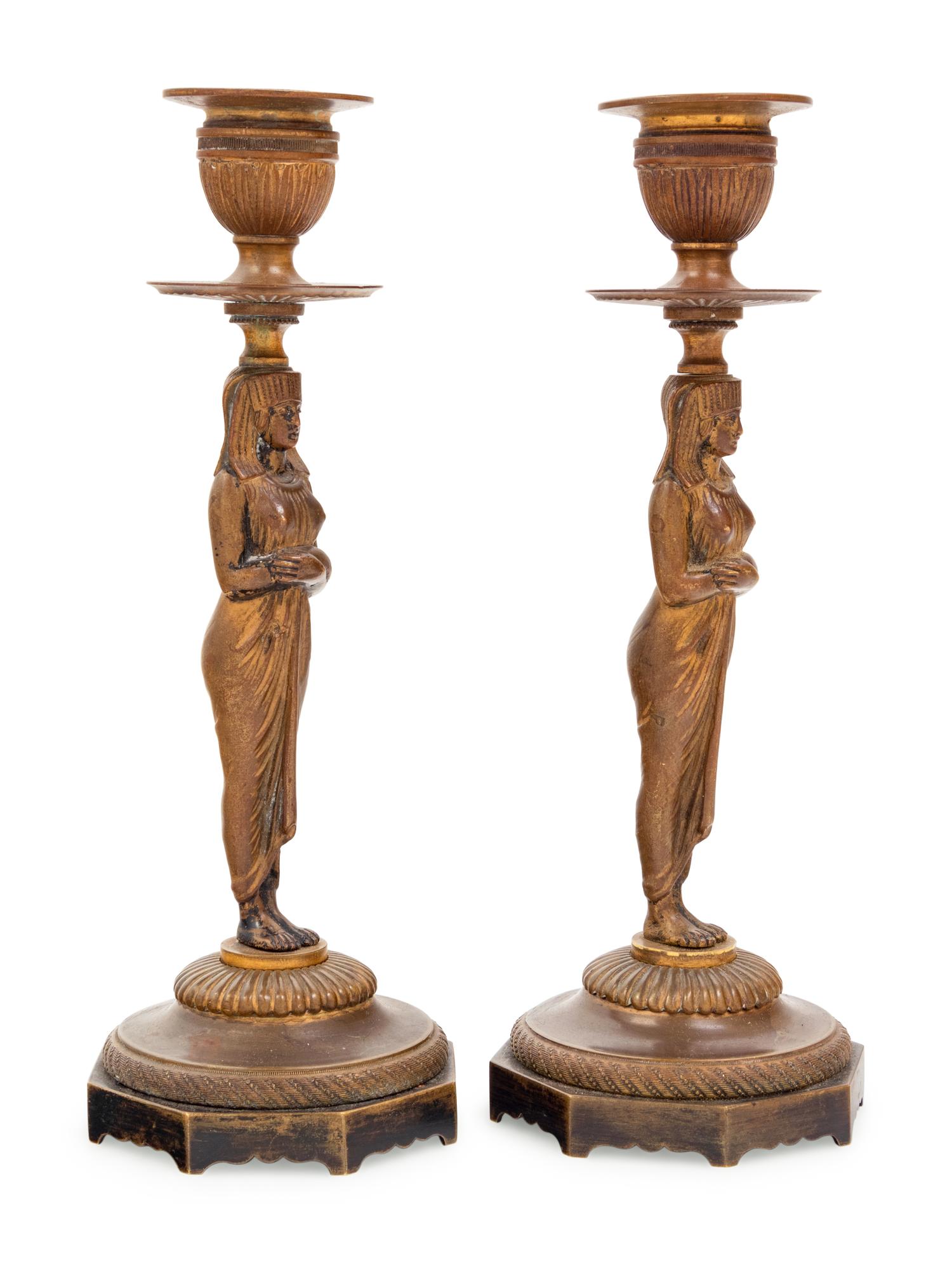 A Pair of Egyptian Revival Bronze Figural Candlesticks