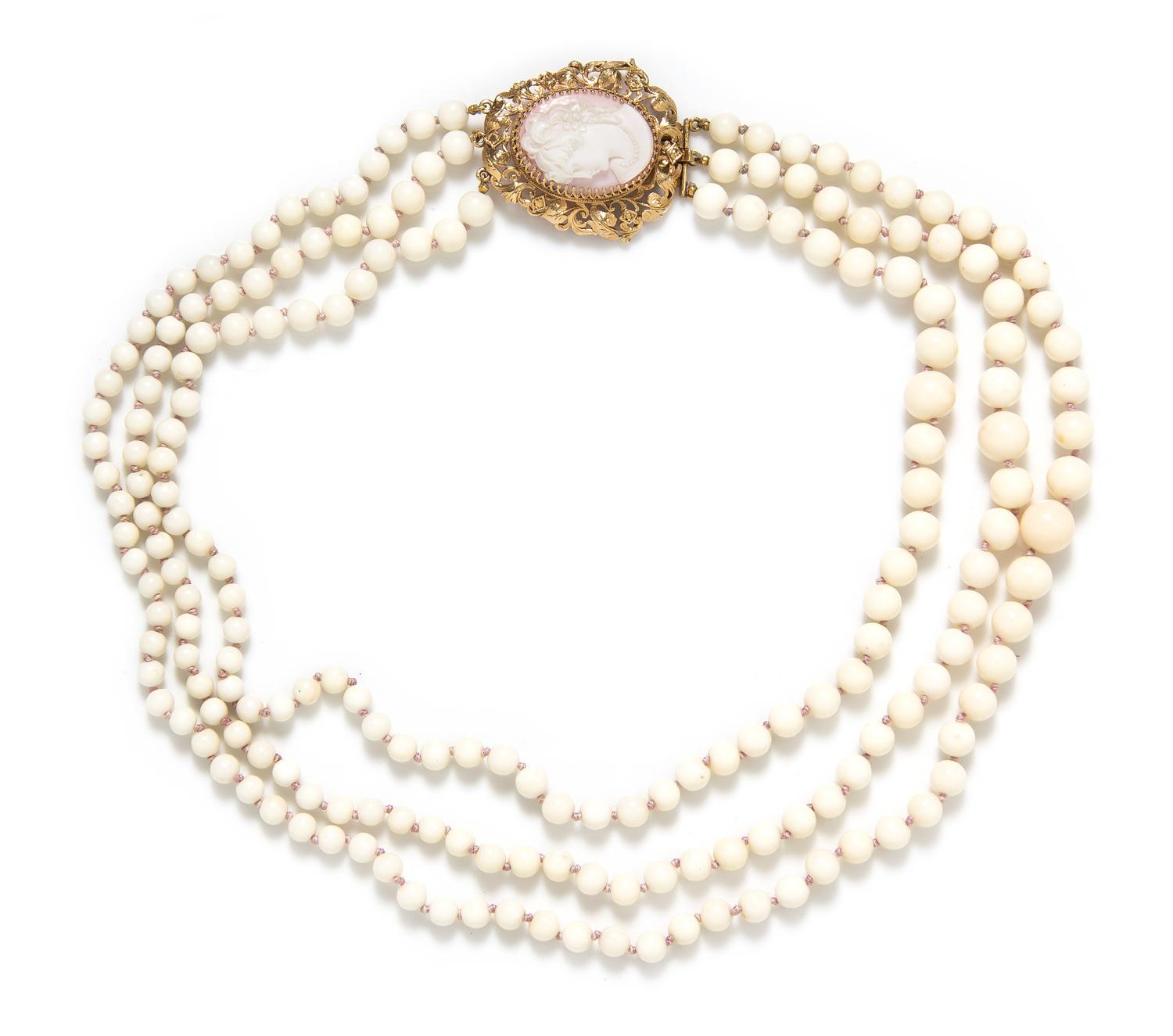 A 14 Karat Yellow Gold, Shell Cameo and Graduated White Coral Multistrand Bead Necklace, 78.20 dwts.
