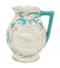 A Collection of Eight English Salt Glazed Relief Form Pitchers and Molded Earthenware — 19TH CENTURY