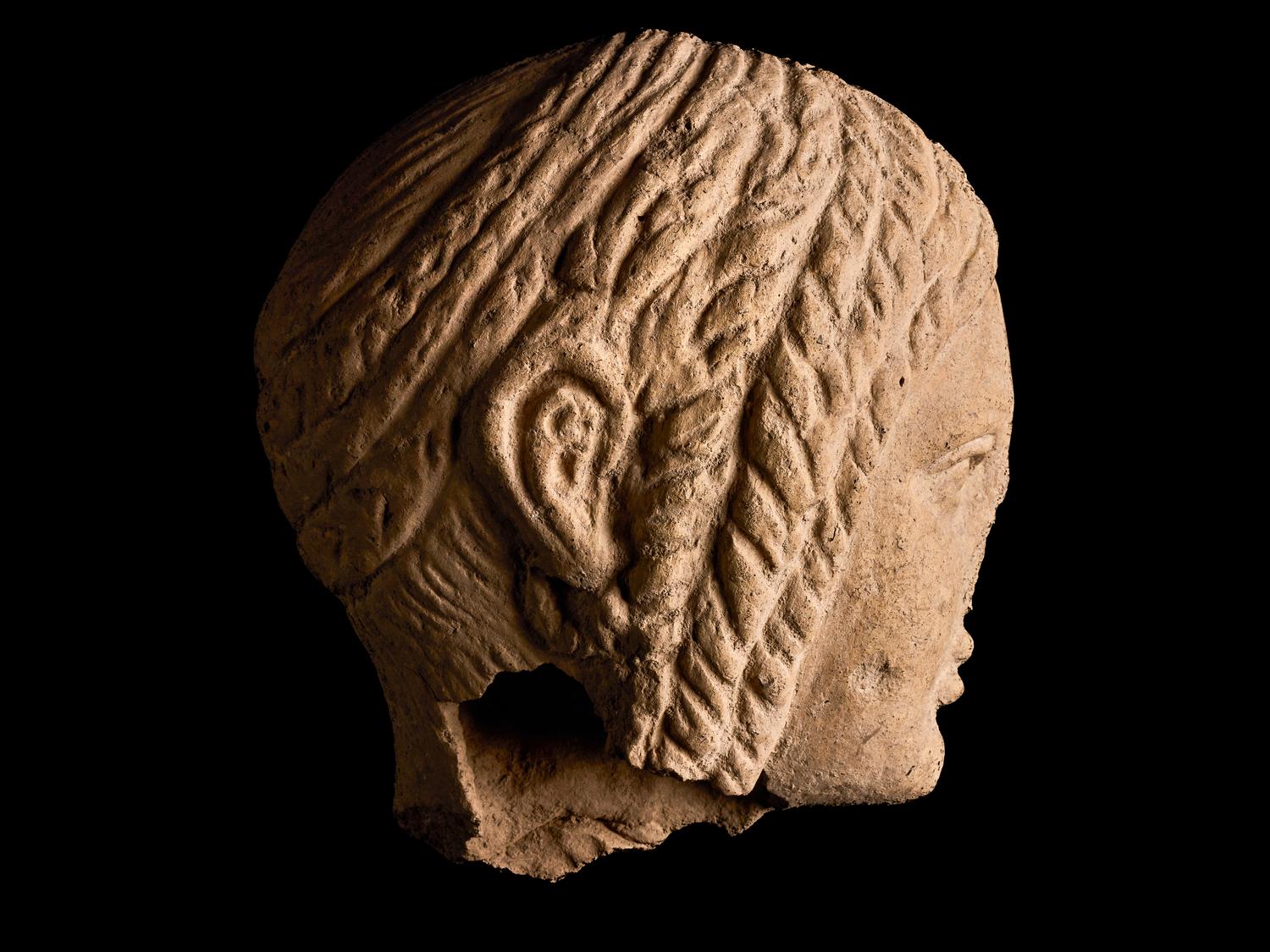 An Etruscan Terracotta Votive Half-Head