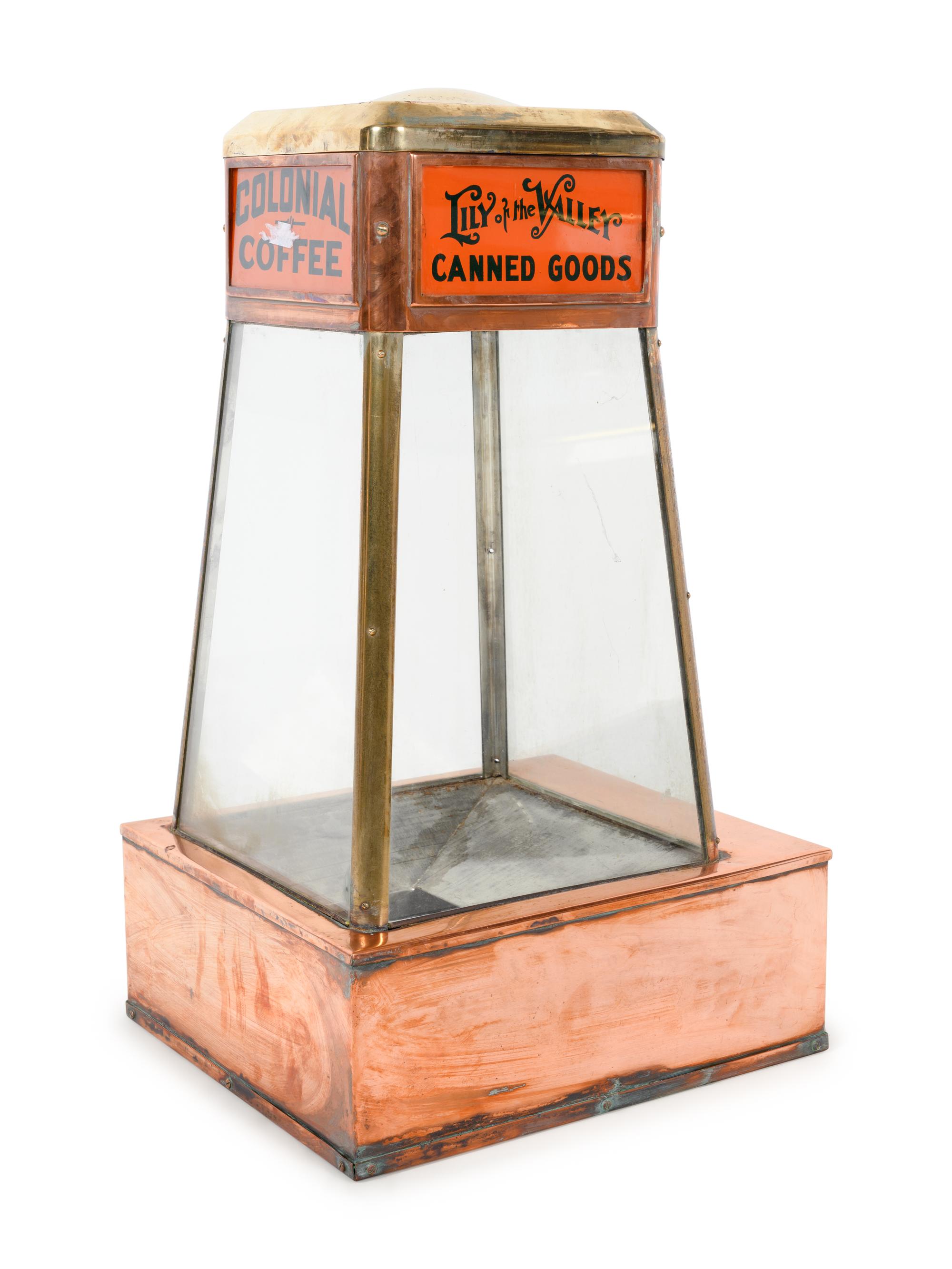 A Dwinell-Wright Co. Coffee Advertising Box, along with a Copper and Brass Colonial Coffee and Lily of the Valley Canned Goods Counter Top Vitrine Display Case