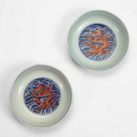An associated pair of iron-red and underglaze blue "Dragon" Dishes 礬红青花龙纹盘子 或为一对 Qianlong six-character seal mark and of the period ????? ? ??
