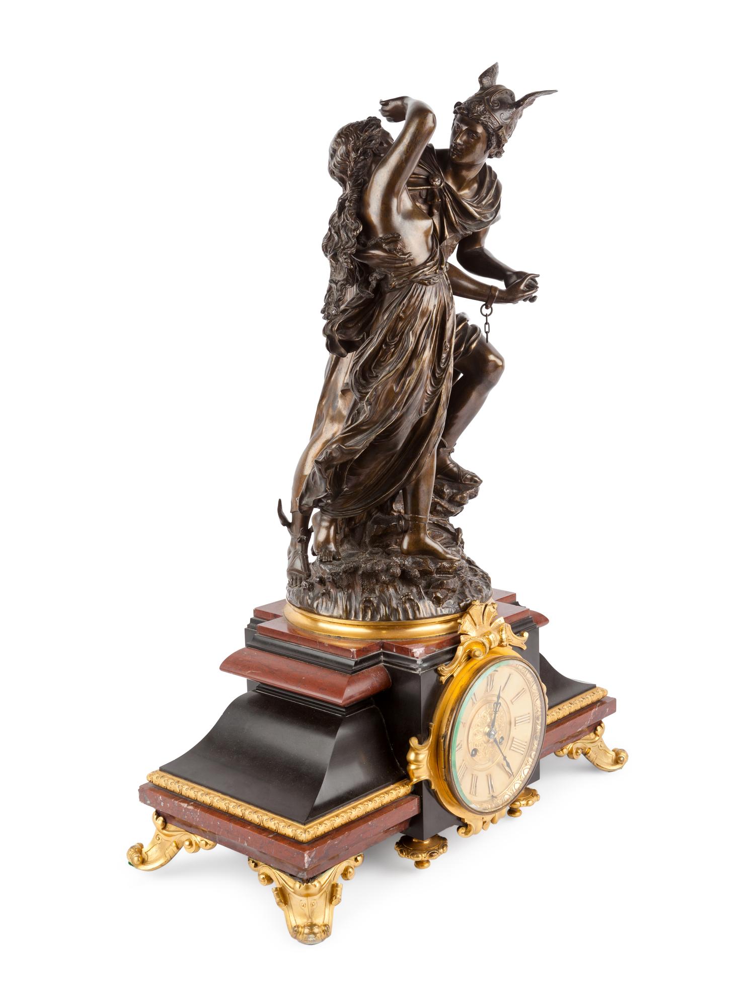A French Gilt and Patinated Bronze and Marble Mantel Clock