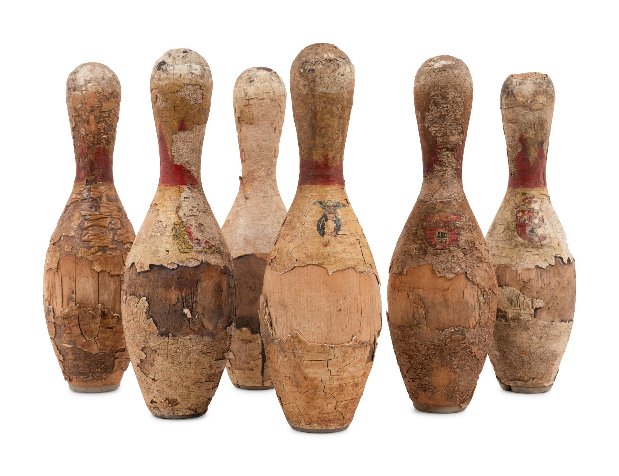 A Set of Twelve Vintage Brunswick Dura-King Red Crown Plastic Coated Wood Bowling Pins