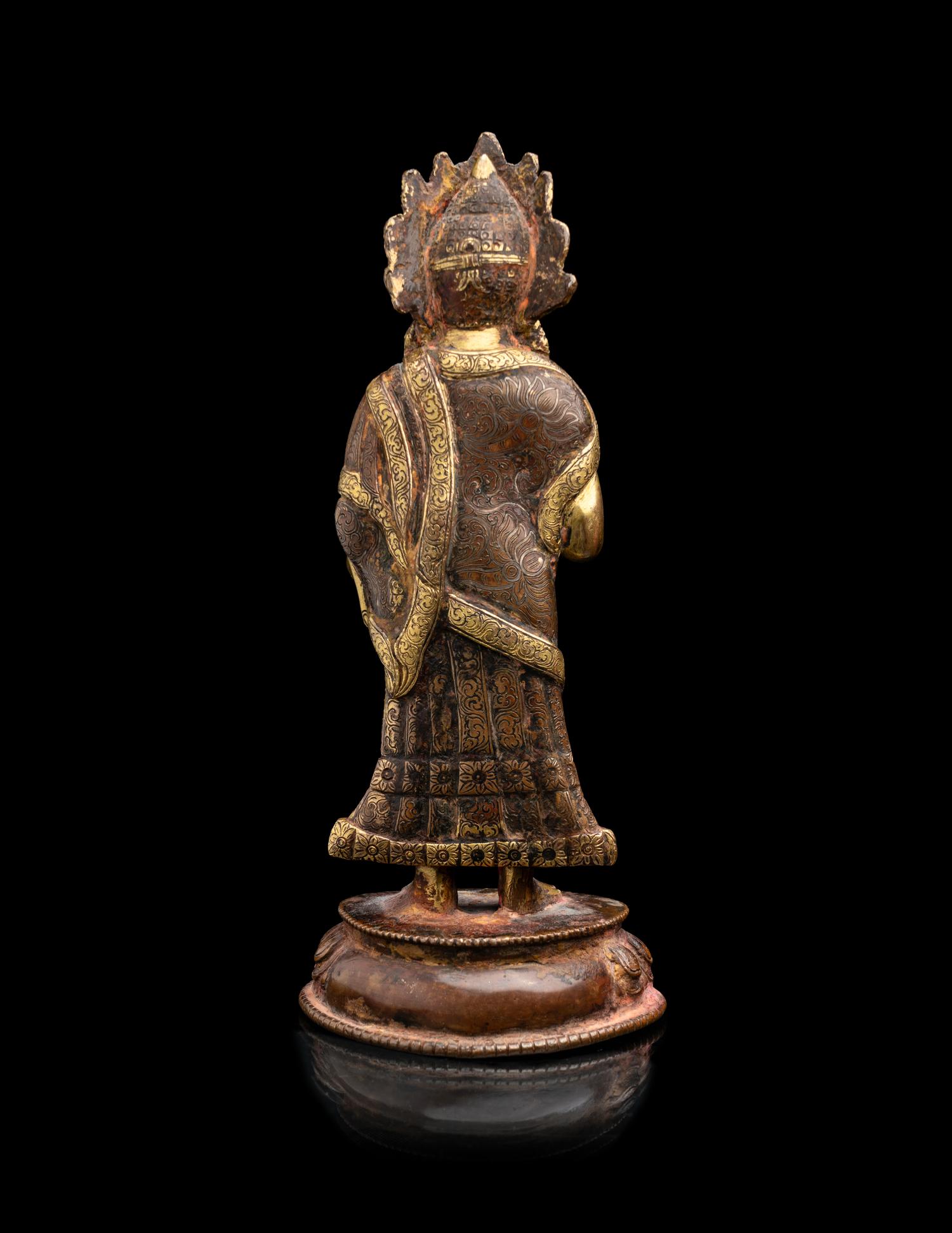A Nepalese Gilt Bronze Standing Figure of Dipankara