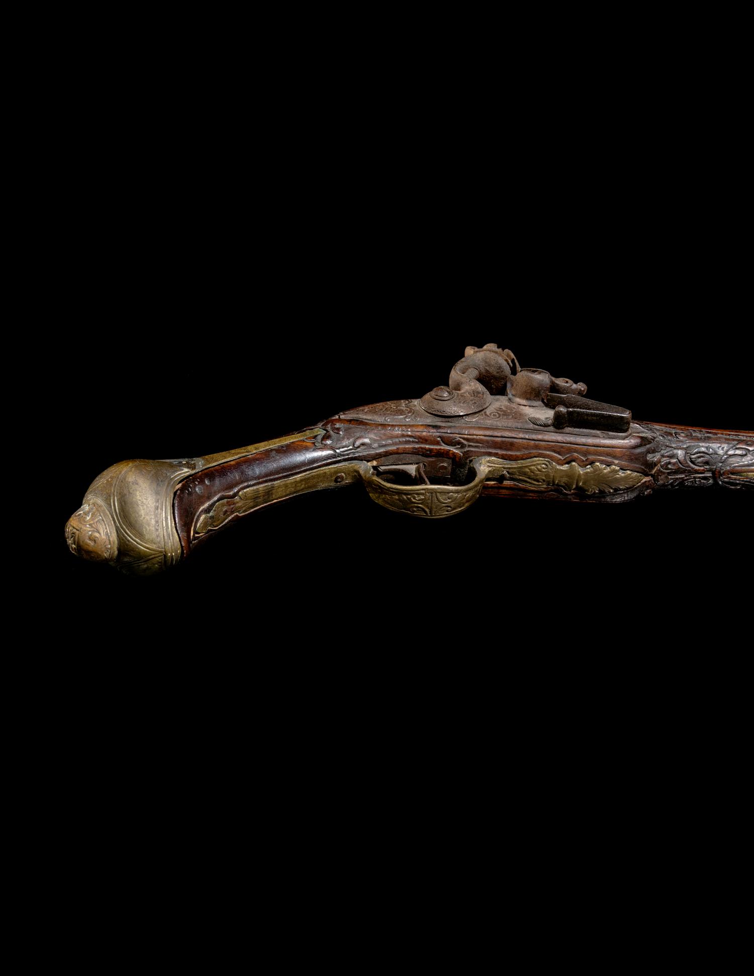 An Engraved Brass-Mounted Flintlock Pistol