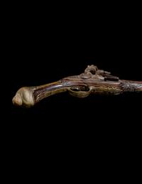 An Engraved Brass-Mounted Flintlock Pistol
