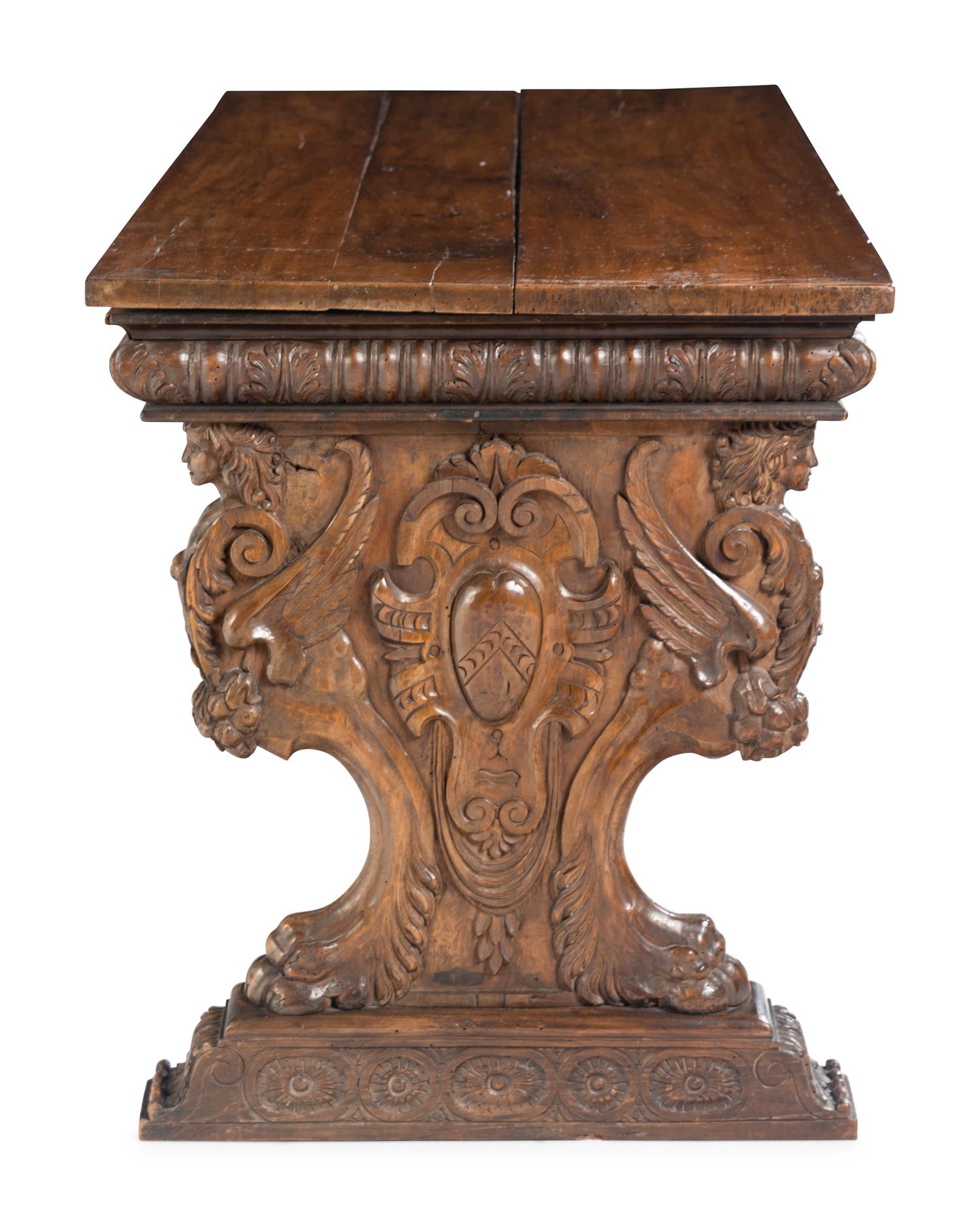 A Florentine Renaissance Style Carved Walnut Trestle Table