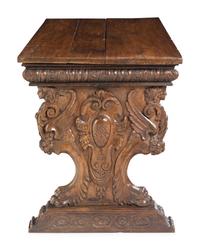 A Florentine Renaissance Style Carved Walnut Trestle Table