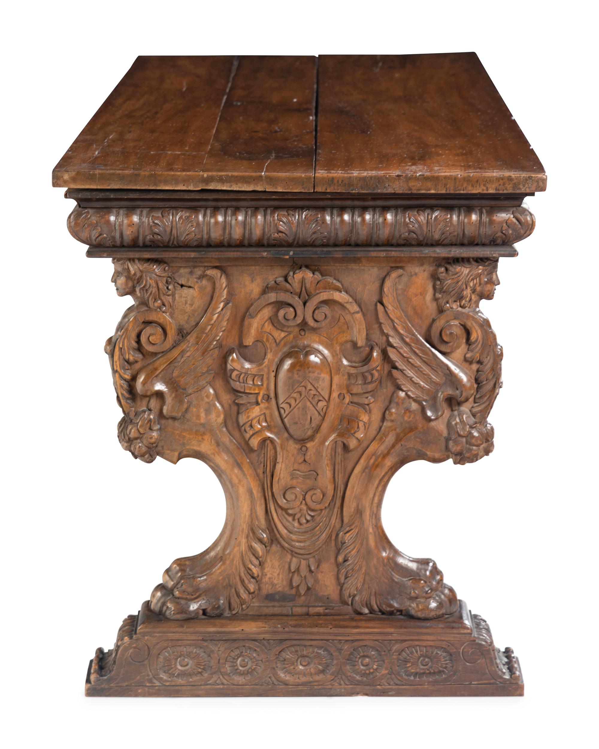 A Florentine Renaissance Style Carved Walnut Trestle Table